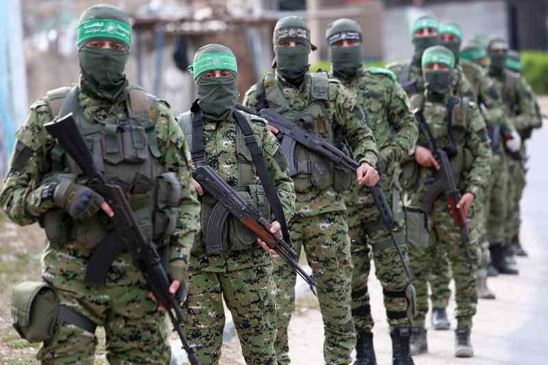 Members,Of,Qassam,Brigades,Of,The,Hamas,Movement,Distribute,Bottles